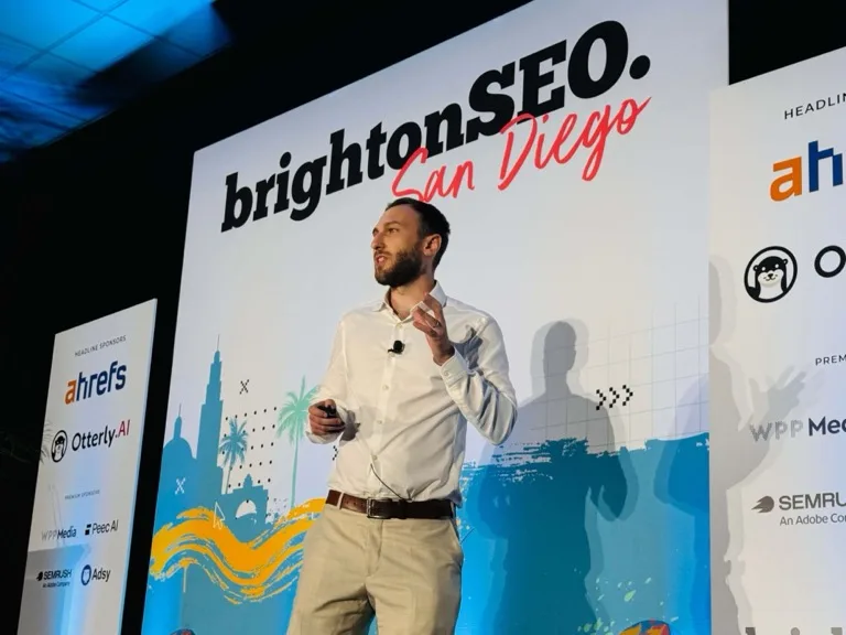 Itamar Blauer speaking on stage at brightonSEO San Diego 2026 about MCP for technical SEO